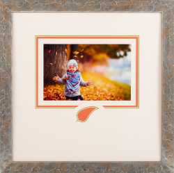 Child playing in leaves